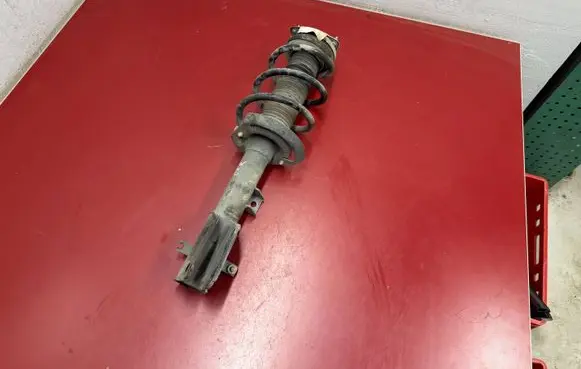 Chrysler Pacifica Front shock absorber with coil spring 68248728AD P68248728AD
