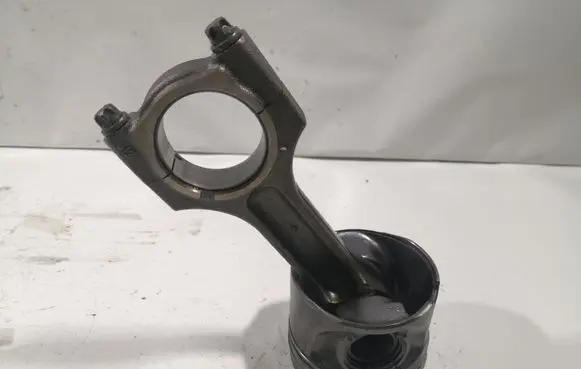 Piston with connecting rod