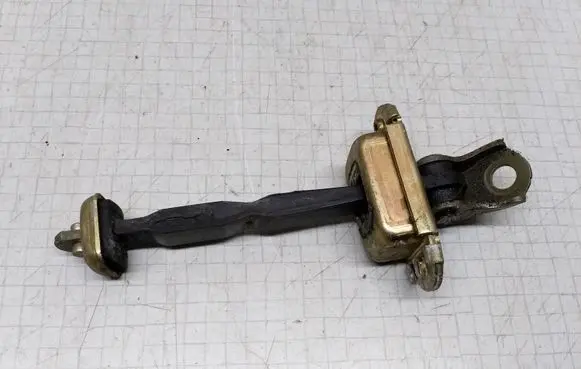 Nissan Primera Front door check strap stopper