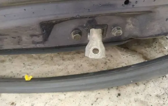 Front door check strap stopper