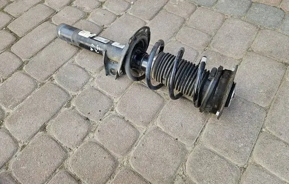 Volkswagen Golf VII Front shock absorber with coil spring 5Q0412037JL