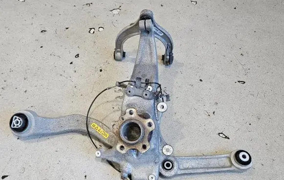 Front wheel hub spindle knuckle