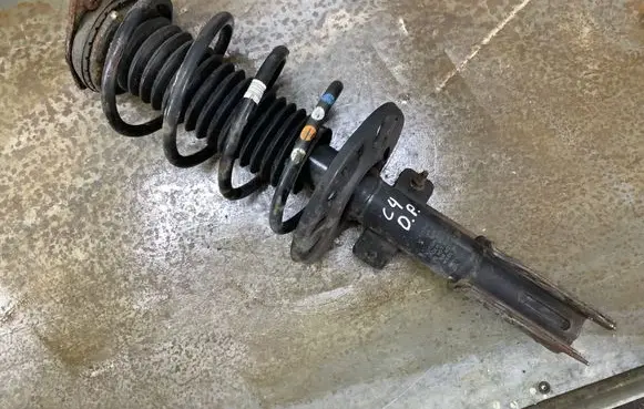 Front shock absorber with coil spring