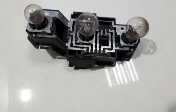Tail light bulb cover holder