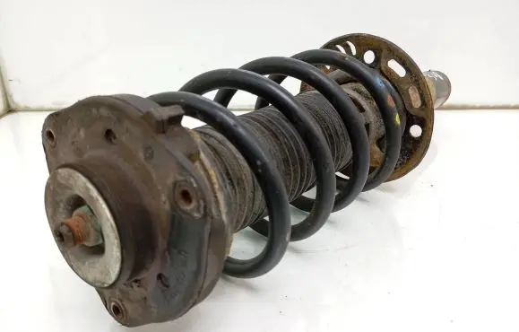 Volkswagen Caddy Front shock absorber with coil spring 1T0413031HQ 1K0412331C
