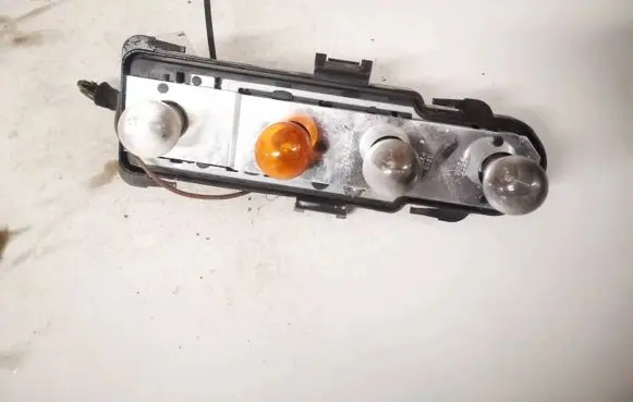 Tail light bulb cover holder