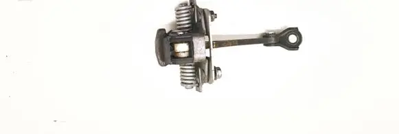 Front door check strap stopper