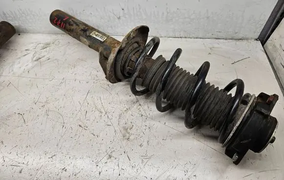 Volkswagen Golf V Front shock absorber with coil spring 1K0413031BF