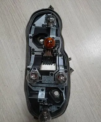 Opel Corsa D Tail light bulb cover holder 