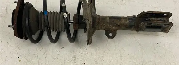 Front shock absorber with coil spring
