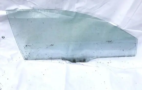 Mazda 323 Front door window glass four-door