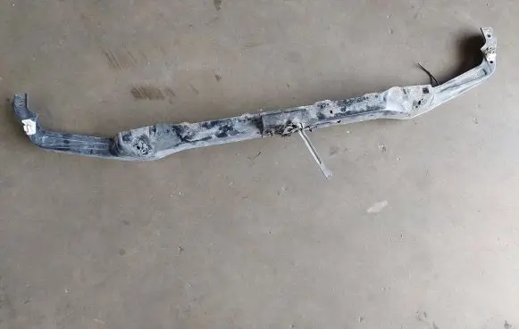 Top upper radiator support slam panel