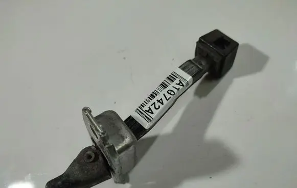 Front door check strap stopper