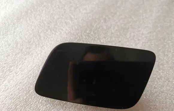 Headlight washer spray nozzle cap/cover