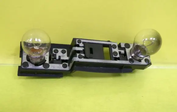 Tail light bulb cover holder