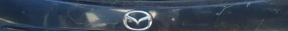 Trunk door license plate light bar