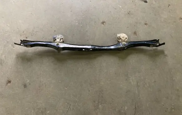 Top upper radiator support slam panel