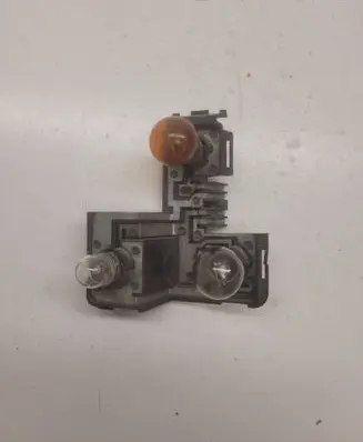 Tail light bulb cover holder