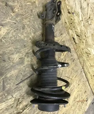 Subaru Impreza III Front shock absorber with coil spring