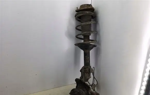 Subaru Forester SF Front shock absorber with coil spring 