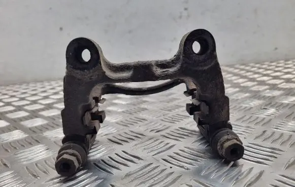 Volkswagen PASSAT B6 Brake caliper pad carrier rear 