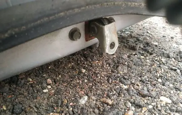Front door check strap stopper