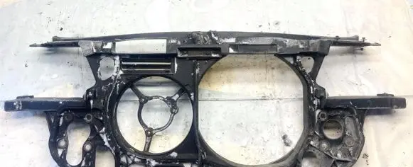 Radiator support slam panel