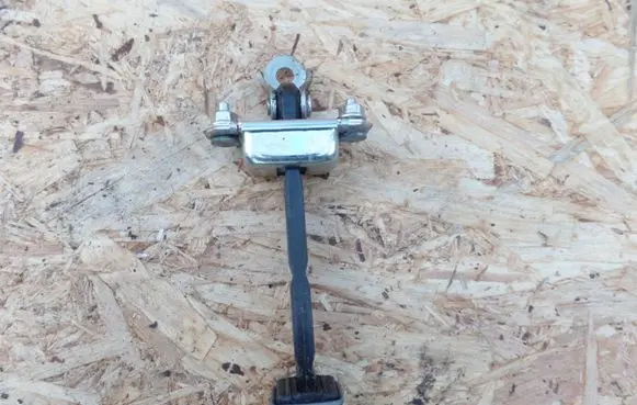 Subaru Legacy Front door check strap stopper