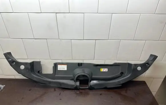 Engine bonnet/hood lock trim molding