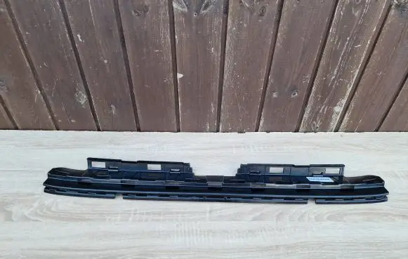 Engine bonnet/hood lock trim molding