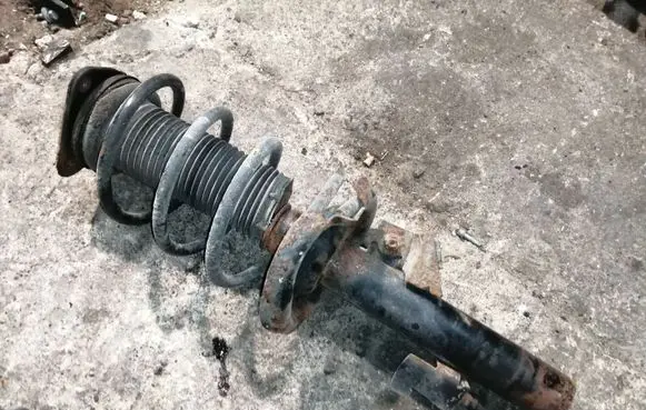 Front shock absorber with coil spring