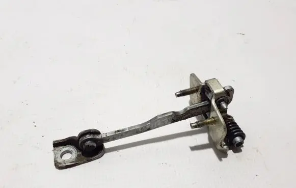 Front door check strap stopper