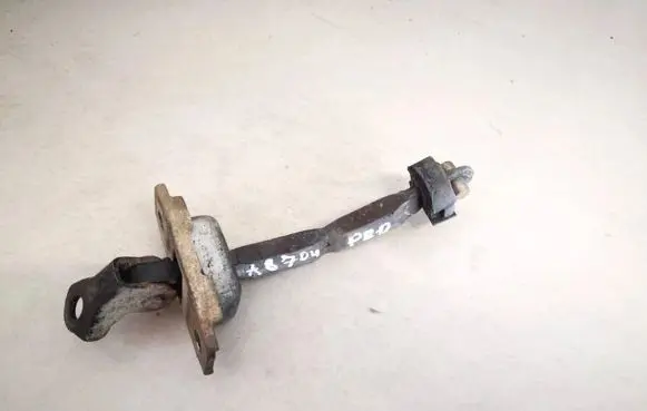 Front door check strap stopper