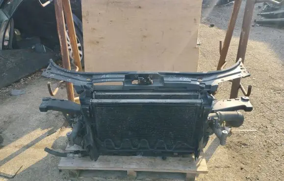 Radiator support slam panel