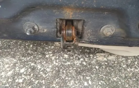 Front door check strap stopper