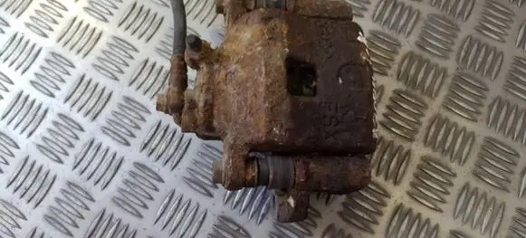 Mazda 323 F Front brake caliper