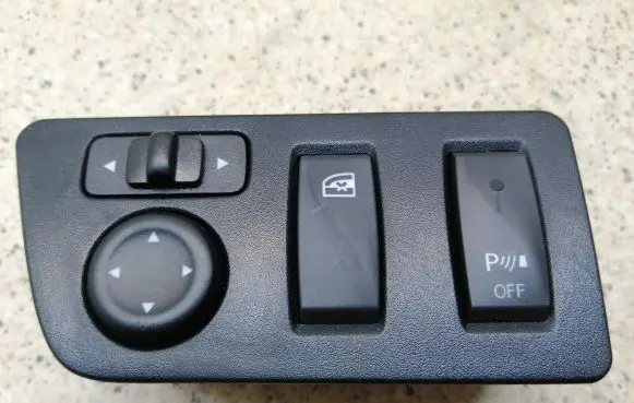 Dacia Spring Wing mirror switch 255702585R