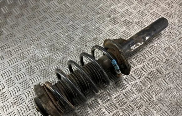 Volkswagen Caddy Front shock absorber with coil spring