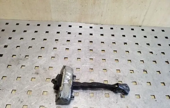 Front door check strap stopper
