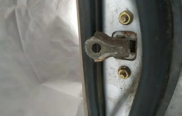 Subaru Legacy Rear door check strap stopper