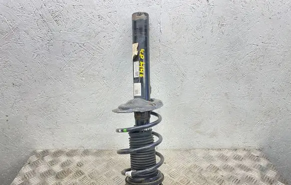 Volkswagen Golf VII Front shock absorber with coil spring 5Q0412037QH 5Q0413031GG