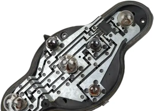 Tail light bulb cover holder