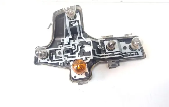 Tail light bulb cover holder