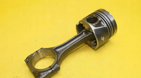 Piston with connecting rod