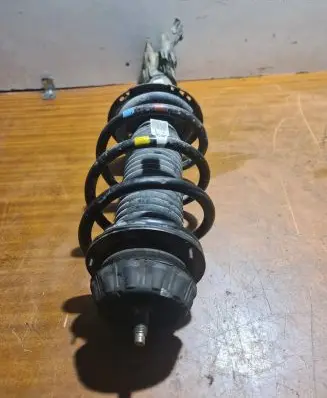 Front shock absorber with coil spring