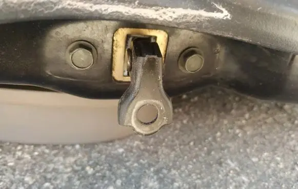 Front door check strap stopper