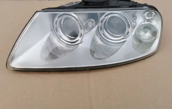 Volkswagen Touareg I Headlight/headlamp 7L6941015BB