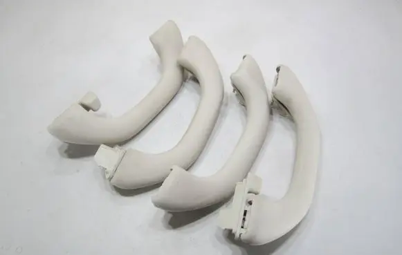 Volkswagen PASSAT B7 A set of handles for the ceiling 1K0857607N