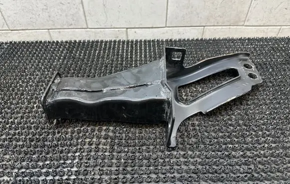 Radiator support slam panel bracket
