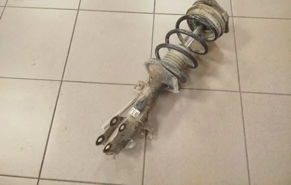 Nissan NV200 Front shock absorber with coil spring 